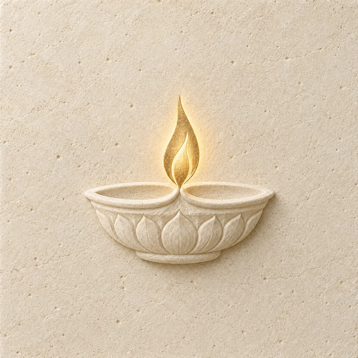 Carved stone diya with a single flame